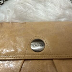 Kenneth Reaction cream small clutch purse.